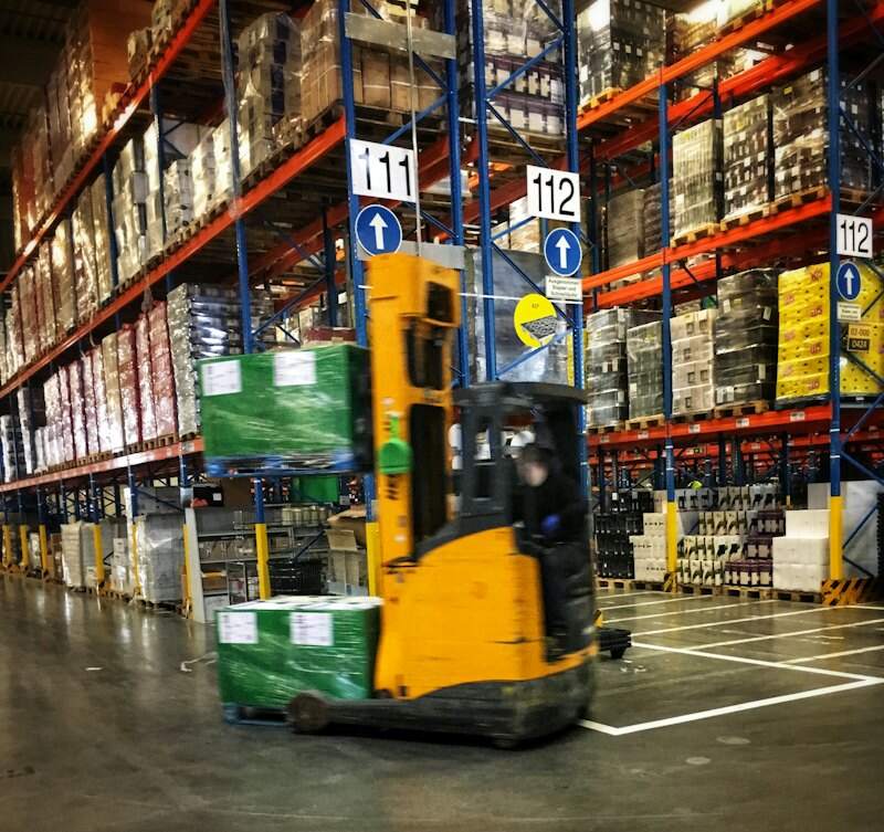 A forklift moving through a warehouse